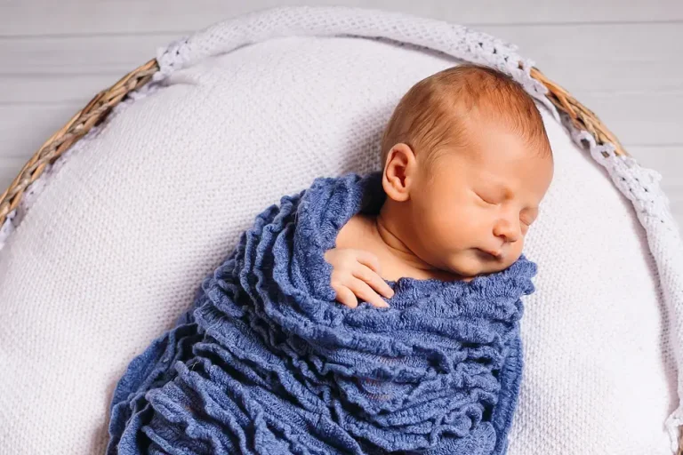 baby wrapped in blue blanket