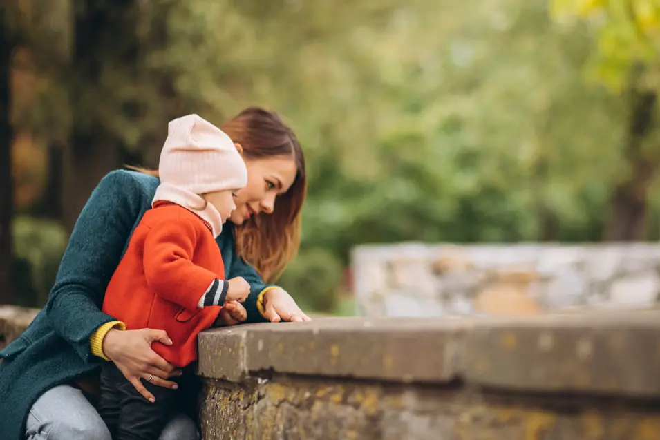 mom and daughter in orange coat