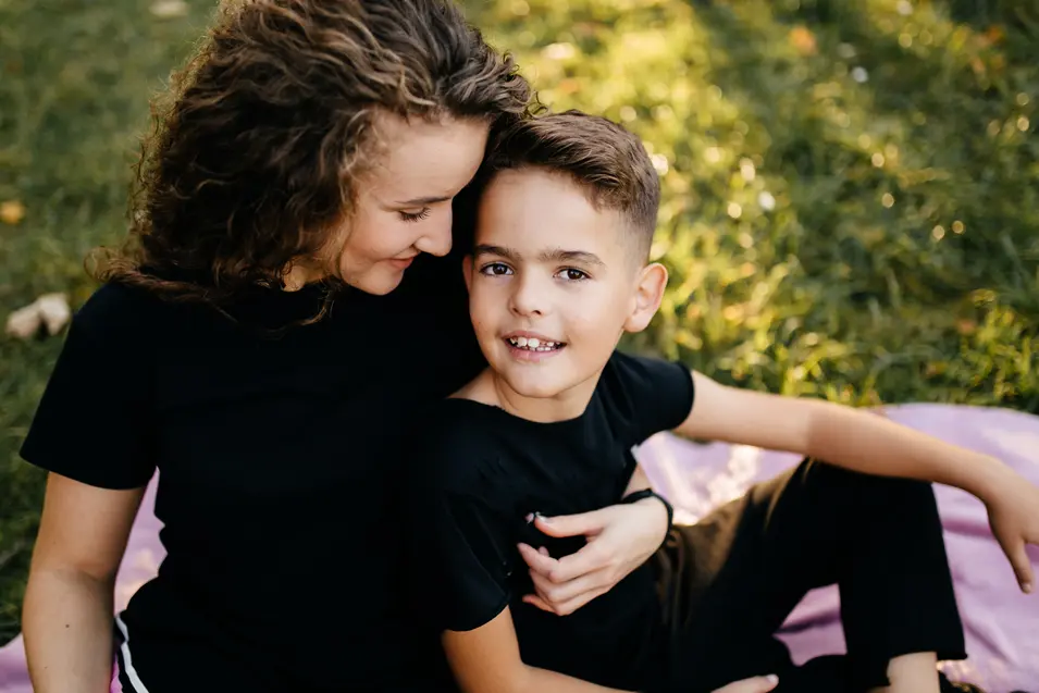 mom holding her son