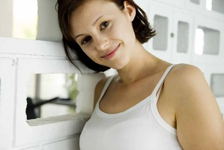 closeup of a woman in a white shirt