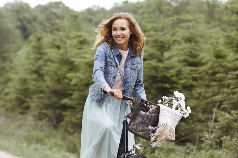 woman pushing a bike