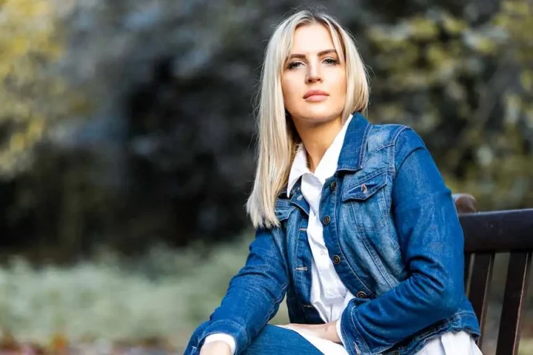 blonde in a bluejean coat